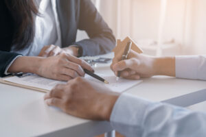 ASC Realty Advisors going over paperwork with a client